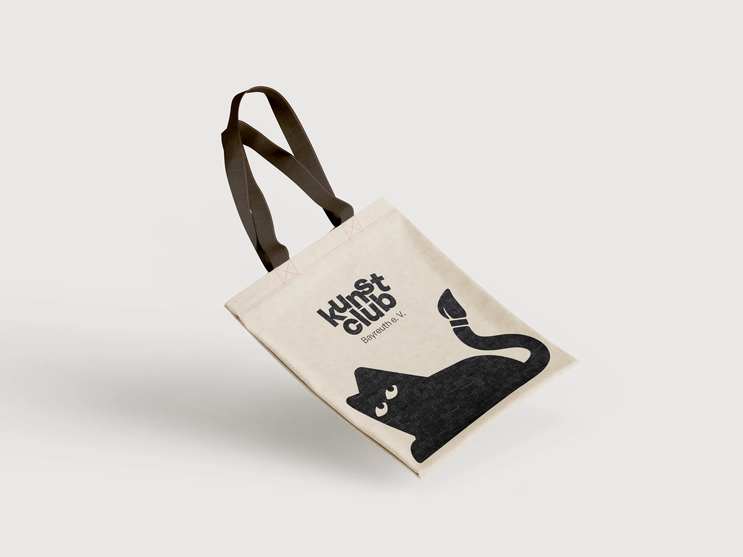 A jute bag with the Kunstclub logo screen printed on the front